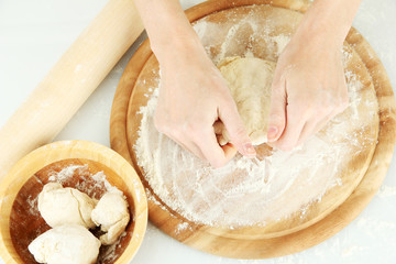 Preparing pizza dough isolated on white