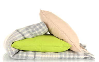 Woolen checkered plaid and pillows, isolated on white