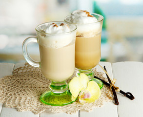 Fragrant coffee latte in glasses cups with spices,