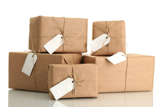 parcels boxes with kraft paper, isolated on white