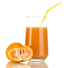 Delicious tangerine juice in glass and mandarins next to it