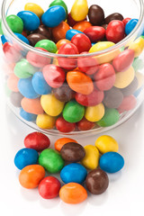 group colored chocolate balls; within a canister