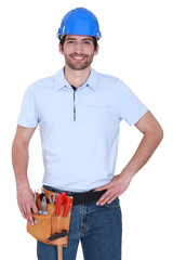 Handyman stood with hand on hip