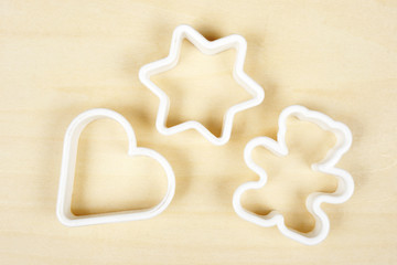 Forms for cookies on plywood background