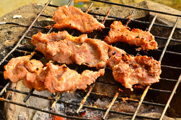 Pig roasting.