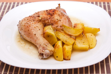 Grilled chicken leg and potatoes