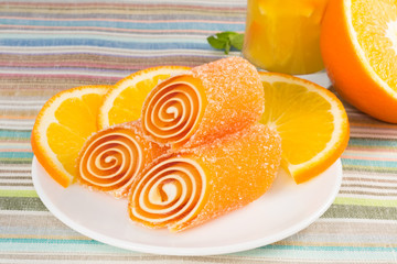 orange candy fruit on a plate