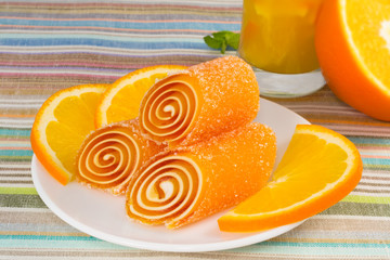 candy fruit on a plate with orange