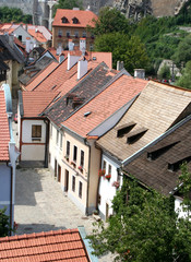 Fototapeta na wymiar Medieval street with red roofs houses in Cesky Krumlov