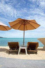 Beach umbrella and longues