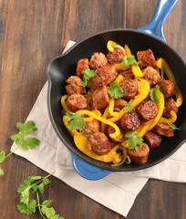 Fried Italian sausage with sweet peppers and onions