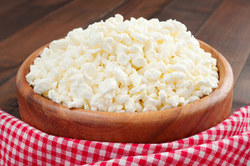 cottage cheese in rustic wooden plate