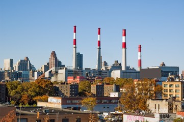 Smoke Stacks and Power Plant in a Urban Landscape