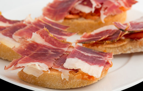 Spanish tapas, ham and tomato