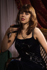 Fashionable women with red wine glass