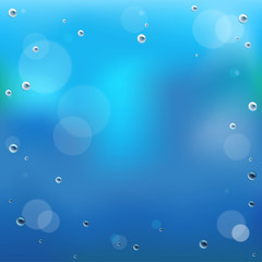 Water drop on glass background.