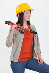 craftswoman holding a spanner