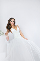 Beautiful smiling girl in a white wedding dress