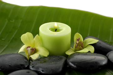 Green spa still life with zen stones and candle ,orchid