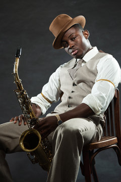 Black American Jazz Saxophone Player. Vintage. Studio Shot.