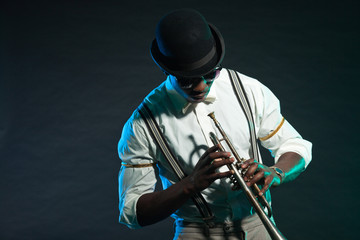 Black american jazz trumpet player. Vintage. Studio shot. © ysbrandcosijn