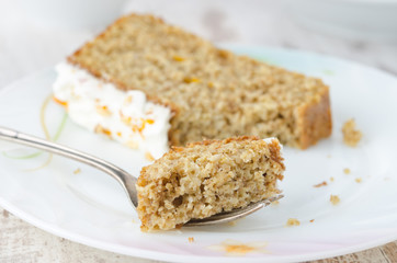 broken-off piece of orange cake on a plate
