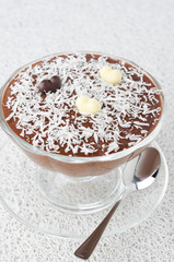 chocolate mousse in a glass sundae dish with chocolate hearts