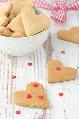 heart shaped cookies on the table and sugar hearts