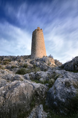 Outlined on a hilltop are the ruins of the Castle of Xiquena