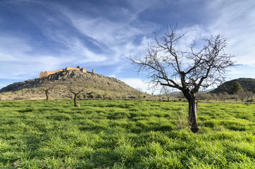 Outlined on a hilltop are the ruins of the Castle of Xiquena - 47912188