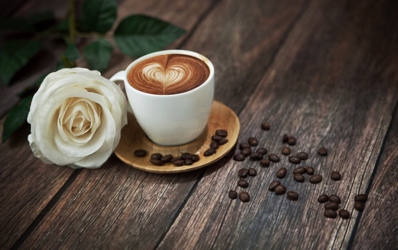 Fototapeta Hot coffee and beautiful white rose