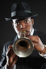 Black american jazz trumpet player. Vintage. Studio shot.
