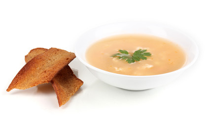 Fragrant soup with garlic croutons isolated on white