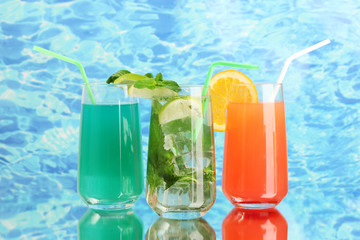 Three cocktails on blue background