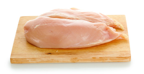 raw chicken meat on cutting board, isolated on white