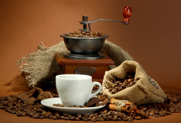 cup of coffee, grinder, turk and coffee beans
