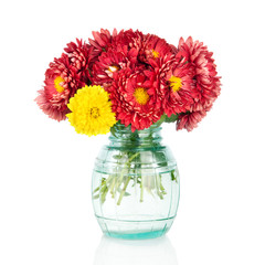 Huge bunch of yellow and red autumn flowers in vase