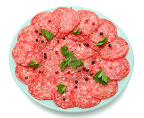 tasty sausage with spices on plate, isolated on white