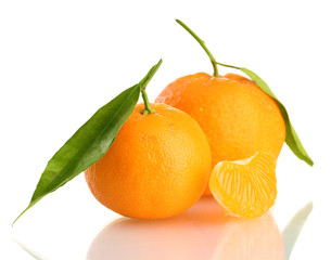 Ripe sweet tangerine with leaves, isolated on white