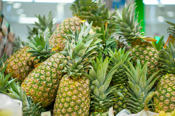 Bunch of pineapples in supermarket