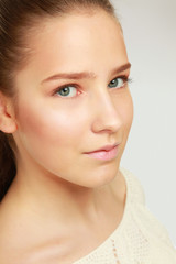 Fototapeta premium A portrait of young woman on white background