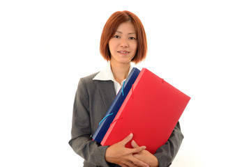 書類を持ち微笑むオフィスレディー
