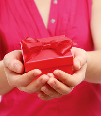 Female hands holding a gift