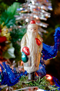 the new-year toy of Santa claus hangs on a christmas tree
