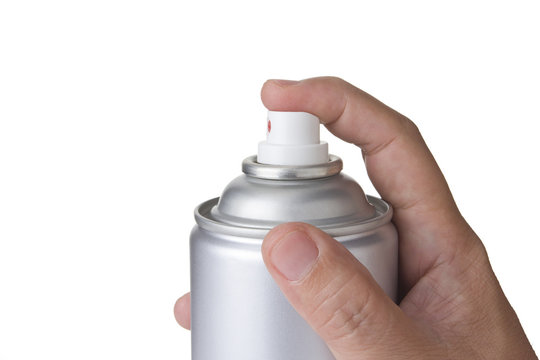 man hand spraying a blank aluminum spray paint can