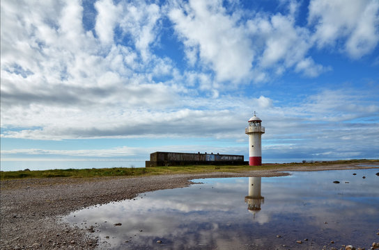 Lighthouse on the shoreline at Millom, Cumbria.