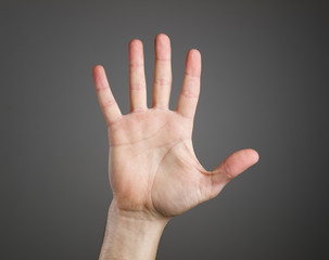 Open hand over dark background