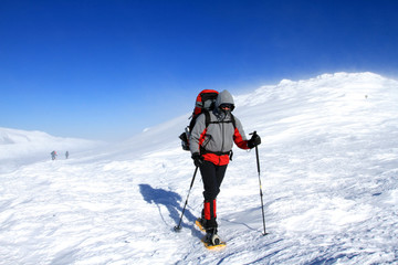 Fototapeta na wymiar Winter hiking in snowshoes.