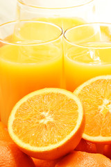 Composition with two glasses of orange juice and fruits
