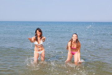 Women Playing in the Water at Seaside